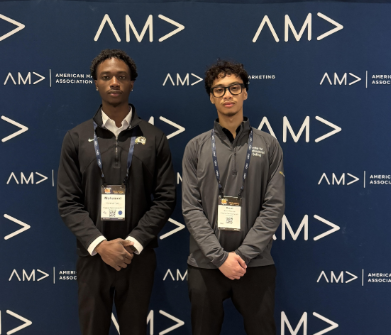 Mo Turay and peer in front of AMA International Collegiate Conference in Chicago